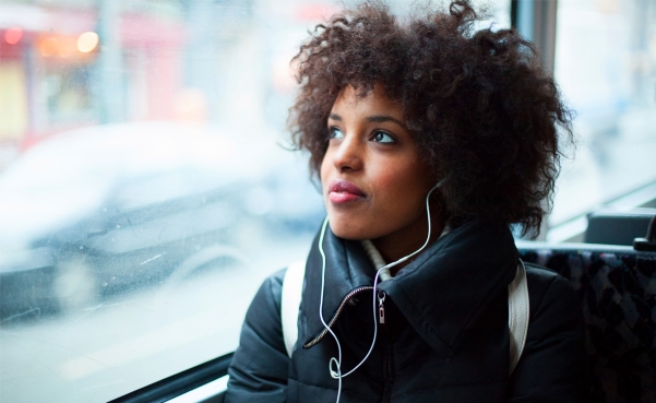 woman on bus with headphones